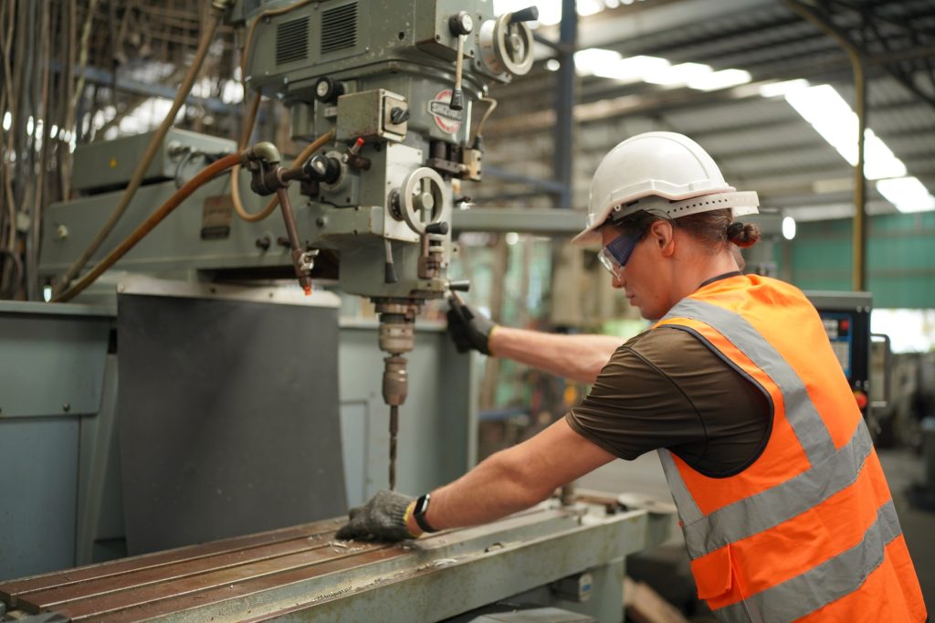 Factory Engineer Operating machines in industry factory.